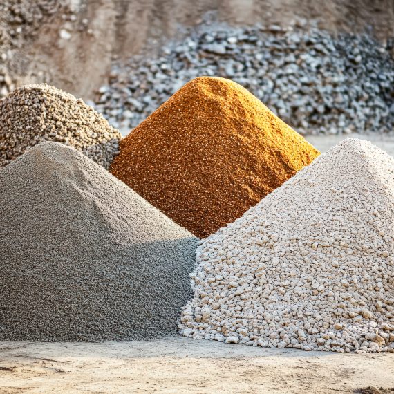 Pile of gravel is stacked on top of another pile of gravel Pile of gravel is stacked on top of another pile of gravel. The gravel is a mix of different colors and sizes