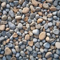 Seamless rough stone gravel texture. Mix of grey, beige stones create natural seamless pattern. Ground surface background. Perfect for design, decor, landscaping, home decor or outdoor projects. Seamless rough stone gravel texture. Mix of grey, beige stones create natural seamless pattern. Ground surface background. Perfect for design, decor, landscaping home decor or outdoor projects.